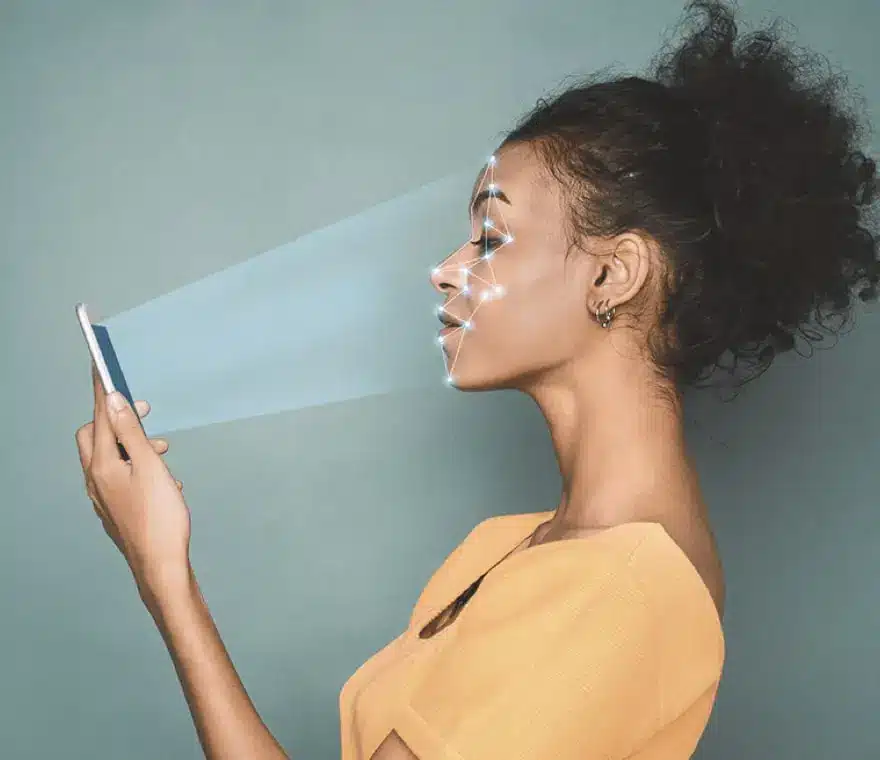 A woman is using the Mask Fit app to scan her face to find the best CPAP mask fit for her.